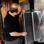 Jamie Ruth of Baseline Inspections checking the furnace filters as part of a pre-listing inspection.